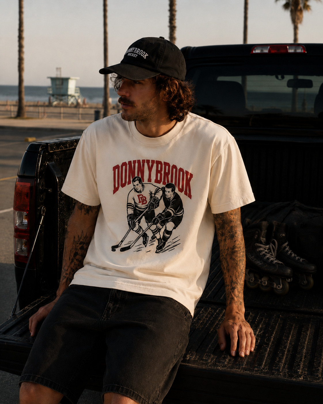 Donnybrook lifestyle — cream vintage hockey tee, truck bed at the beach